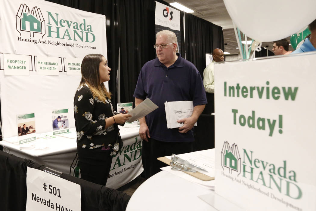 Steve Elman discusses his qualification with Chelsea Lee, learning and development manager at Nevada Hand, during a job fair hosted by the Las Vegas Review-Journal at Palace Station on Thursday, A ...