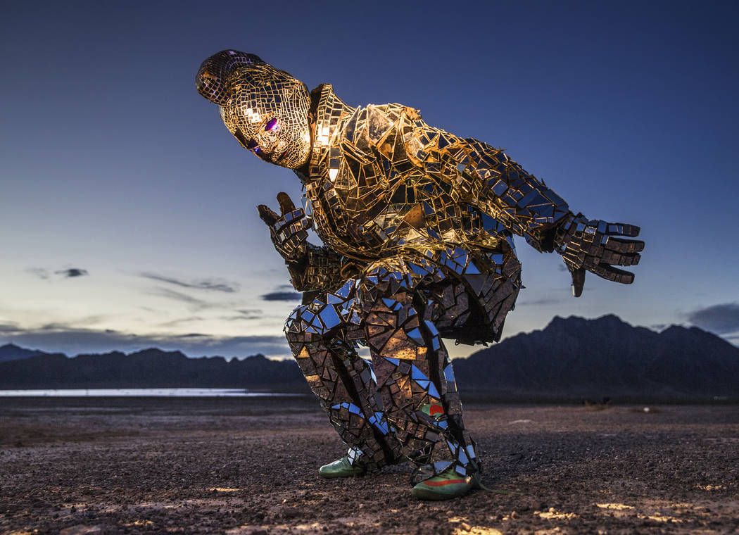 Burner Steve MacWithey, aka "Man in the Mirror," hand made his famous glass suit containing over 5000 mirrored pieces. "The suite allows people to see themselves and the energy they're giving off ...