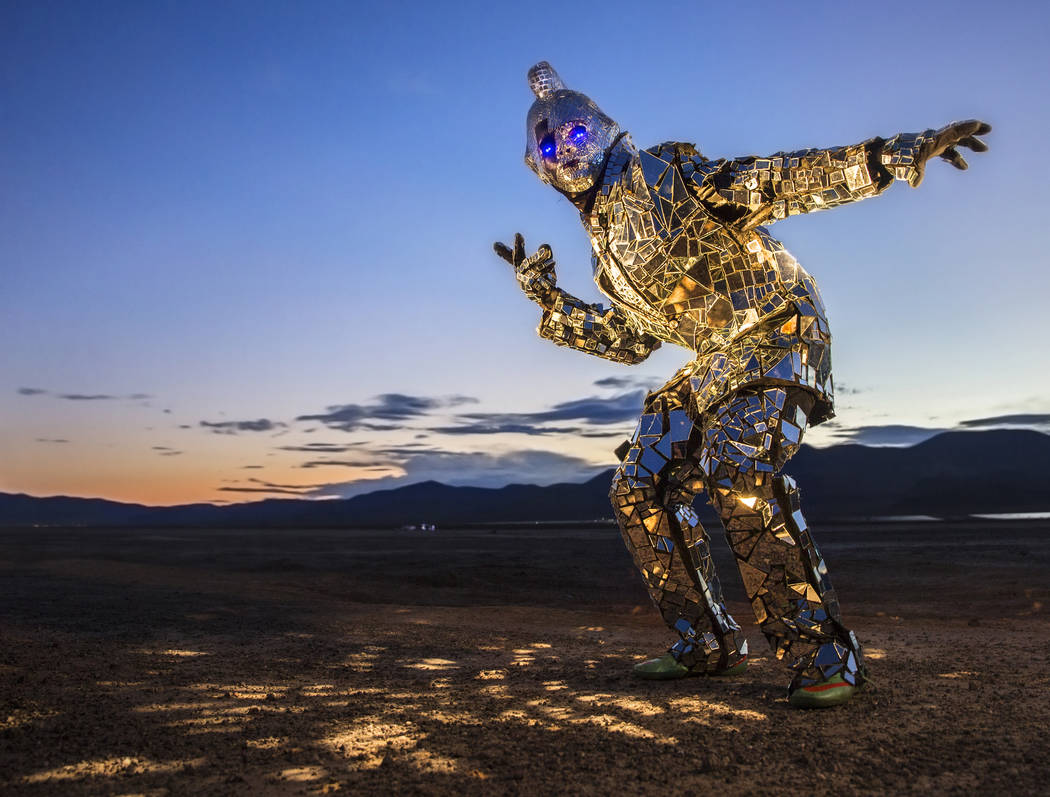 Burner Steve MacWithey, aka "Man in the Mirror," hand made his famous glass suit containing over 5000 mirrored pieces. "The suite allows people to see themselves and the energy they're giving off  ...