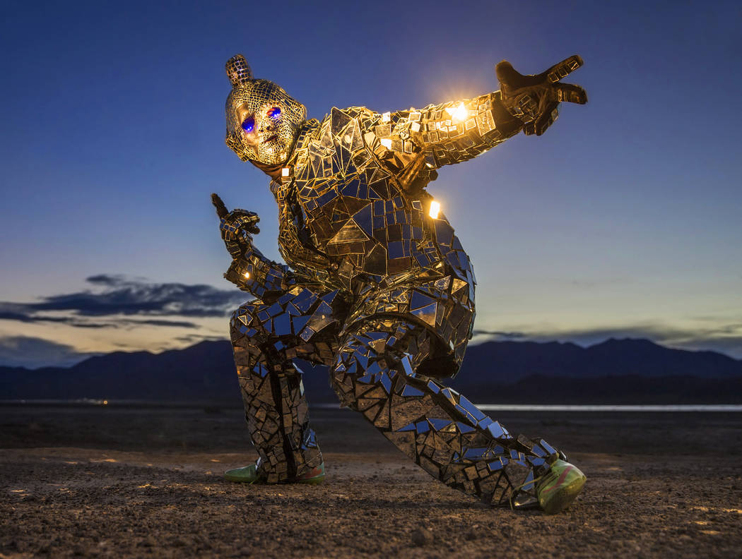 Burner Steve MacWithey, aka "Man in the Mirror," hand made his famous glass suit containing over 5000 mirrored pieces. "The suite allows people to see themselves and the energy they're giving off  ...