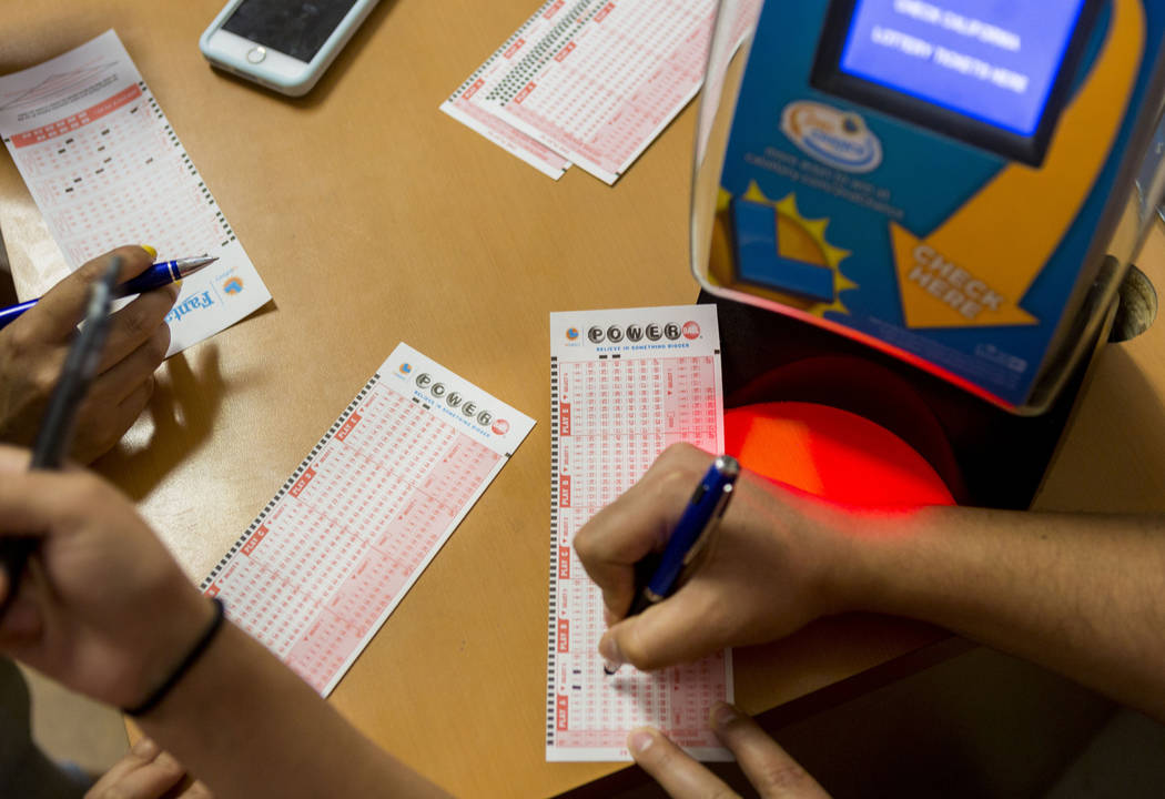 People fill out their numbers on a Powerball ticket at the Primm Valley Lotto Store, Wednesday, Aug. 16, 2017. Elizabeth Brumley Las Vegas Review-Journal