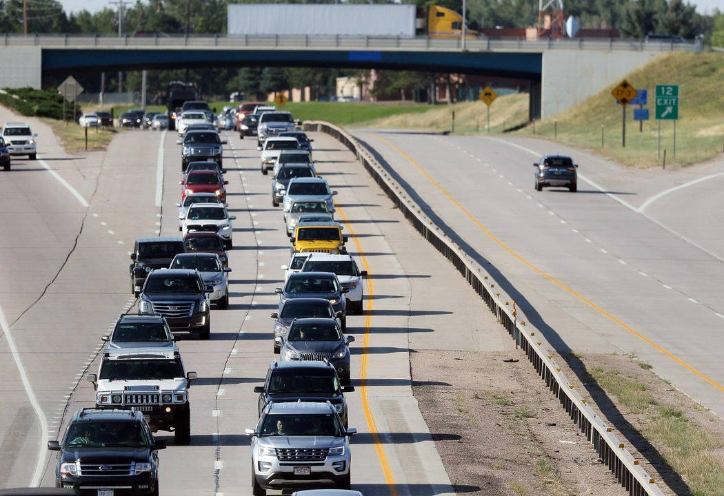 Heavy traffic moving slowly along Interstate 80 in Cheyenne, Wyo., on Aug. 21. (Blaine McCartney/The Wyoming Tribune Eagle via AP)