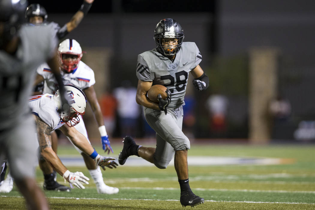 Bishop Gorman's Amod Cianelli (28) runs the ball against DeMatha Catholic in their football game at Bishop Gorman High School in Las Vegas, on Friday, Aug. 25, 2017. Gorman won 35-23. Erik Verduzc ...