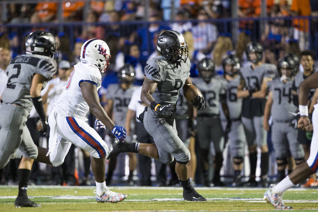 Bishop Gorman's Brevin Jordan (9) runs for a touchdown against DeMatha Catholic in their football game at Bishop Gorman High School in Las Vegas, on Friday, Aug. 25, 2017. Gorman won 35-23. Erik V ...