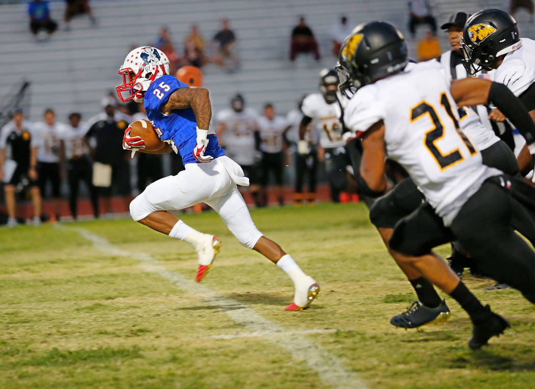 Liberty's running back Kishon Pitts (25) runs into the end zone for a touchdown as Saguaro's Brandon Shivers (21) chases him during the second quarter of a football game at Liberty High School in  ...