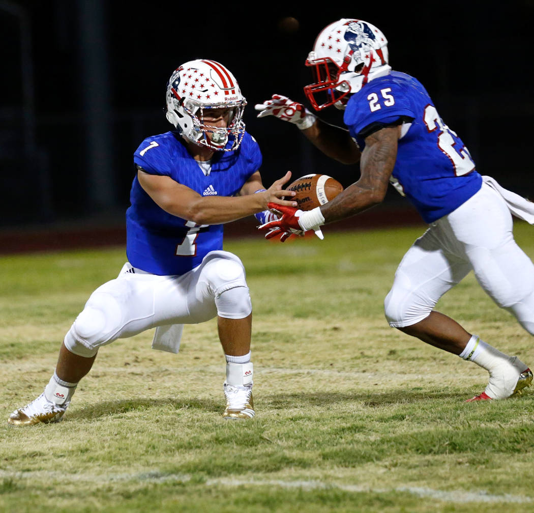 Liberty's Kenyon Oblad (7) passes the ball to Kishon Pitts (25) during the second quarter of a football game against Saguaro at Liberty High School in Henderson, Saturday, Aug. 26, 2017. Chitose S ...