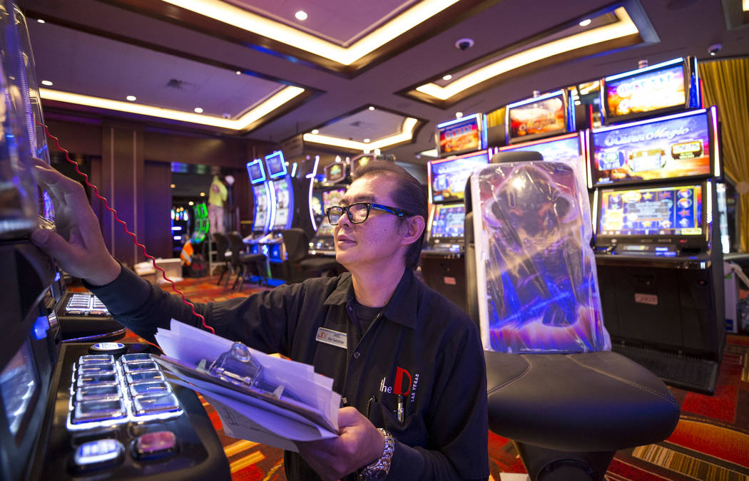 Slot technician Ariel Talosig verifies functionality on a new slot machine  during renovations at the Golden Gate hotel-casino on Thursday, Aug. 25,  2017, in downtown Las Vegas. Richard Brian Las V … |