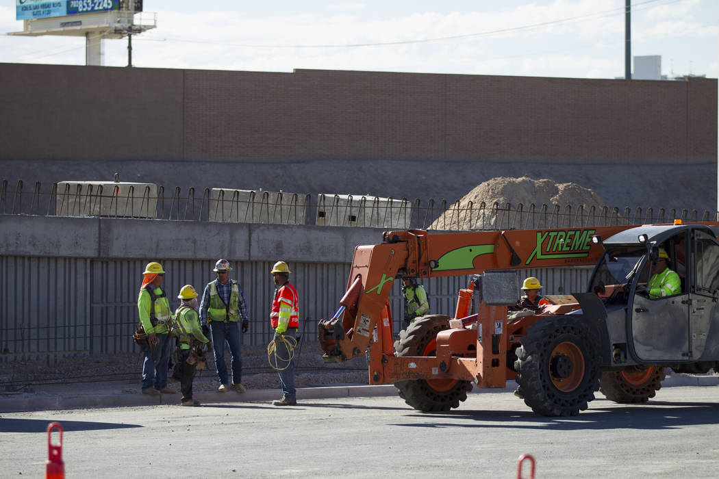 Workers at the construction site of the new portion of Martin Luther King Boulevard at Ellis Avenue, which is being built as part of Project Neon in Las Vegas, on Saturday, Aug. 26, 2017. Erik Ver ...