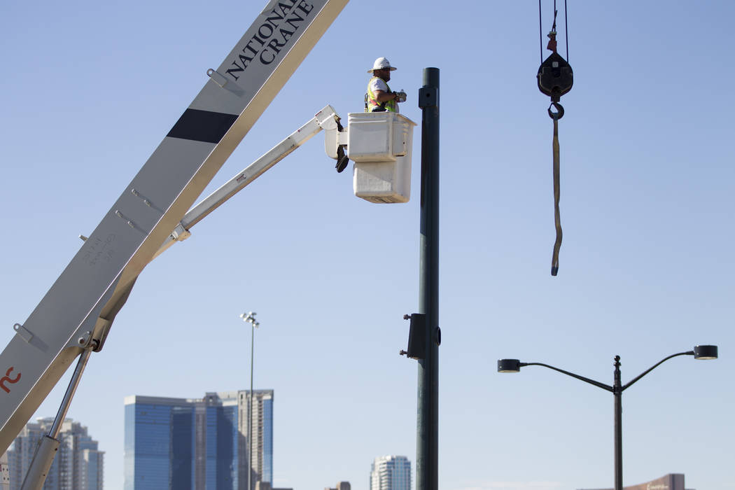 A worker at the construction site of the new portion of Martin Luther King Boulevard at Ellis Avenue, which is being built as part of Project Neon in Las Vegas, on Saturday, Aug. 26, 2017. Erik Ve ...