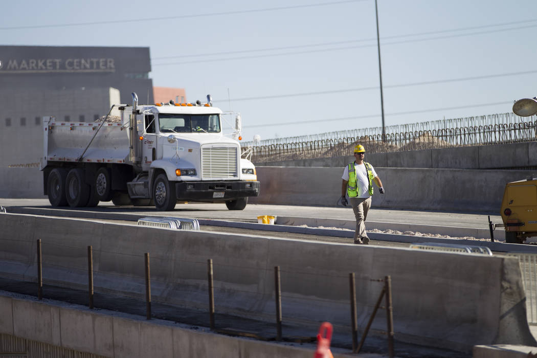 Peter Weiss, utilities manager, walks on the new Martin Luther King Boulevard, between Bearden Drive and Ellis Avenue, which is being built as part of Project Neon in Las Vegas, on Saturday, Aug. ...