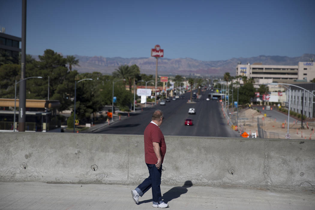 A man who declined to be identified walks a portion of the new Martin Luther King Boulevard, which is being built as part of Project Neon, in Las Vegas, on Saturday, Aug. 26, 2017. Erik Verduzco L ...