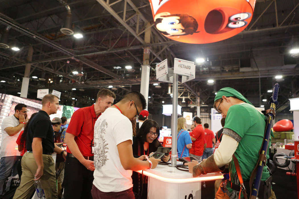 Metroid: Samus Returns is being tested on a Nintendo 3DS handheld game console during the 2017 GameStop Expo at the Sands Expo and Convention Center, Sunday, Aug. 27, 2017 . Elizabeth Brumley Las ...