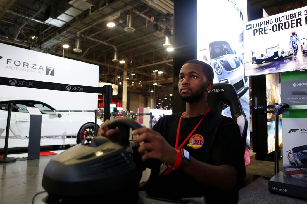 Attendee of the 2017 GameStop Expo Timothy Barnes plays on the Xbox One X, a new Video Game Console that will be available November 7, 2017, during the 2017 GameStop Expo at at the Sands Expo and  ...