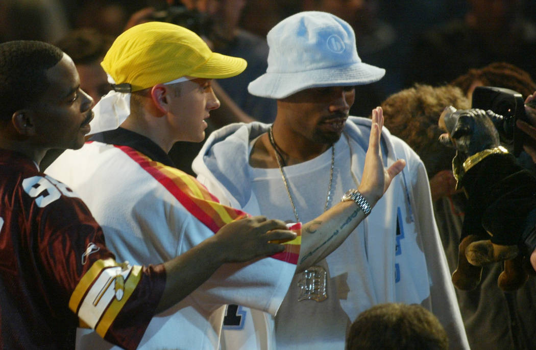 Eminem waves his hand in the face of Triumph, the comic dog, after Triumph involved Eminem in commentary about Moby during the MTV Video Music Awards at New York's Radio City Music Hall Thursday, ...