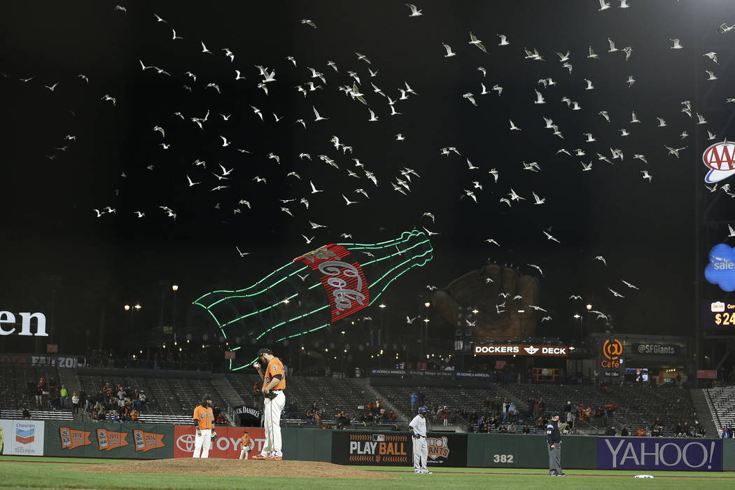 Former San Francisco Giants relief pitcher George Kontos stands on the mound as seagulls fly over AT&T Park in the 11th inning of a baseball game against the San Diego Padres in San Francisco  ...