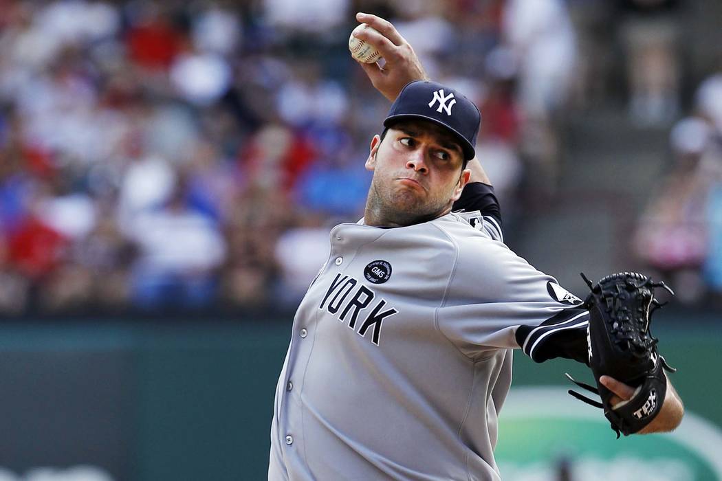 New York Yankees relief pitcher Jonathan Albaladejo throws a pitch in the seventh inning during a baseball game against the Texas Rangers on Sunday, Sept. 12, 2010, in Arlington, Texas. Texas won ...