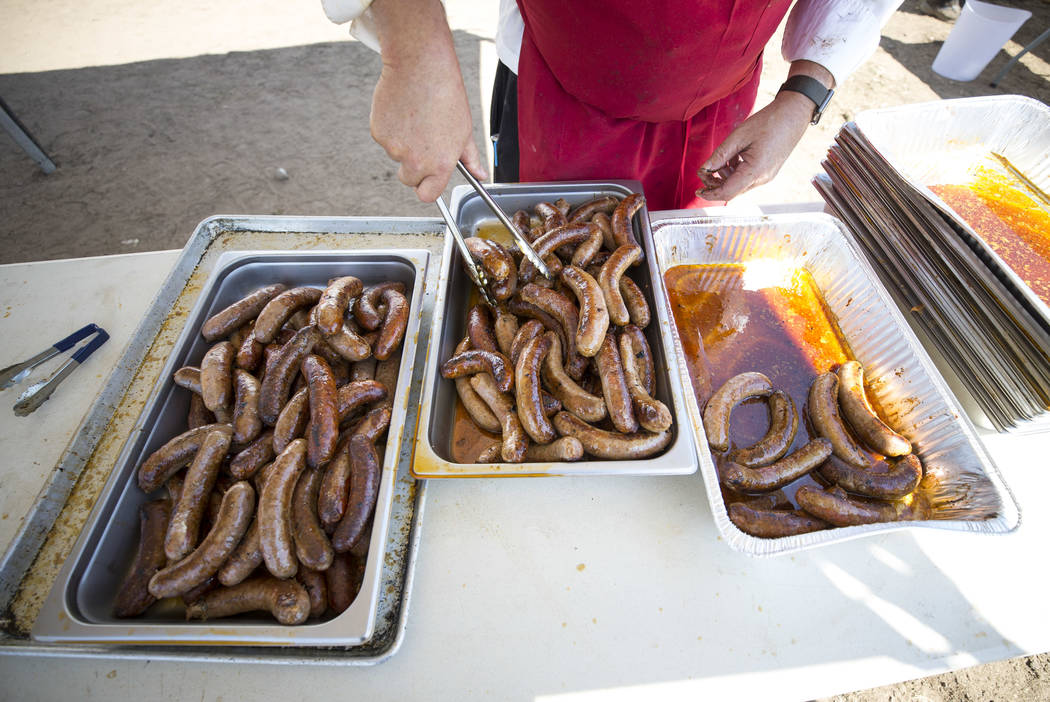 Executive chef Ed Mitchell serves up a batch of chorizo sausage links during the third annual Basque Fry held at Corley Ranch in Gardnerville, Nev. on Saturday, Aug. 26, 2017. Richard Brian Las Ve ...