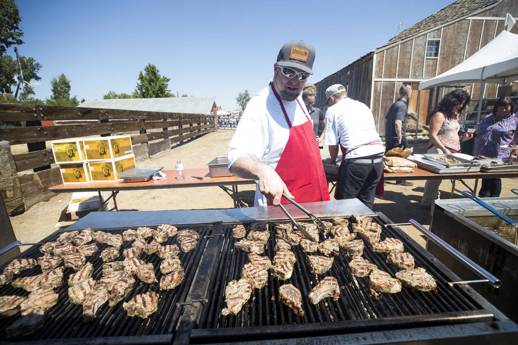 Grill master Jonathan Williams prepares lamb chops during the third annual Basque Fry held at Corley Ranch in Gardnerville, Nev. on Saturday, Aug. 26, 2017. Richard Brian Las Vegas Review-Journal  ...