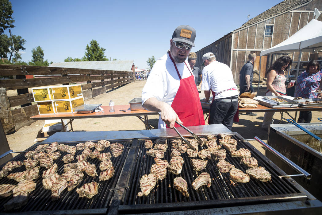 Grill master Jonathan Williams prepares lamb chops during the third annual Basque Fry held at Corley Ranch in Gardnerville, Nev. on Saturday, Aug. 26, 2017. Richard Brian Las Vegas Review-Journal ...