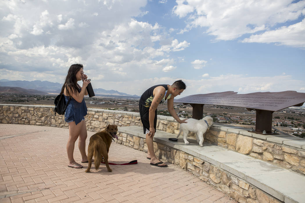 Rose and Eric Chung take in the views at Exploration Peak Park with their dogs Scooby, left, and Furrawrri on Sunday, Aug. 6, 2017. Patrick Connolly Las Vegas Review-Journal @PConnPie
