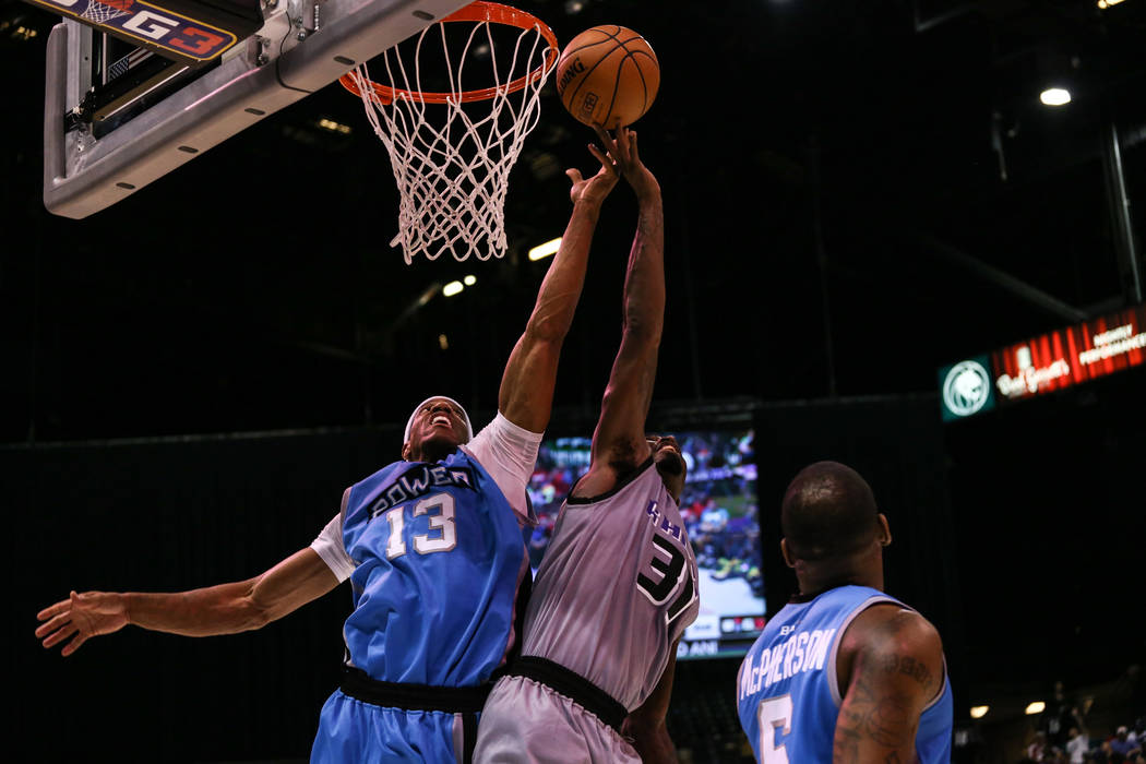 Power's Jerome Williams (13) and Ghost Ballers' ՠRicky Davis (31) jump for a rebound during the second half of the runner-up game of the Big 3 Championship at the MGM Grand Garden Arena in Las Ve ...