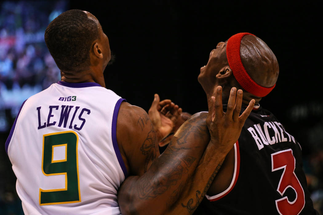3 Headed Monsters' ՠRashad Lewis (9) and Trilogy's Al Harrington (3) prepare to get a rebound during the first half of the Big 3 Championship match at the MGM Grand Garden Arena in Las Vegas on A ...