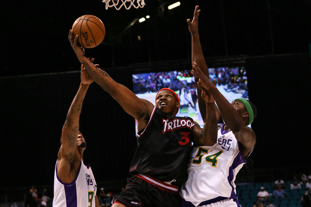 Trilogy's Rashad McCants (32) argues with 3 Headed Monsters