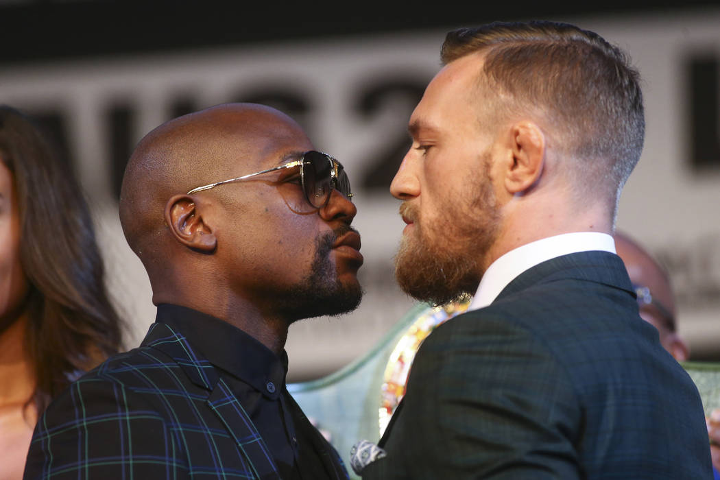 Floyd Mayweather Jr., left, and Conor McGregor face off during the final press conference ahead of their fight, slated for Aug. 26 at the T-Mobile Arena, at the Ka Theatre at the MGM Grand in Las  ...