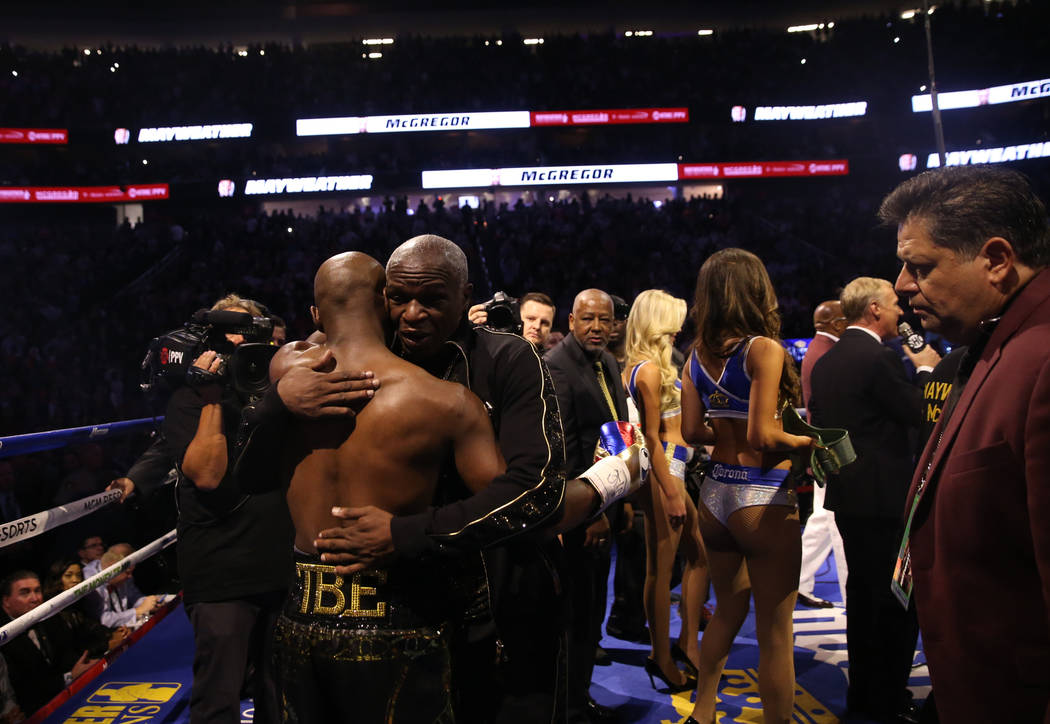 Floyd Mayweather Jr., left, hugs his father, Floyd Mayweather, before his fight against Conor McGregor at T-Mobile Arena, Saturday, Aug. 26, 2017, in Las Vegas. Benjamin Hager Las Vegas Review-Journal