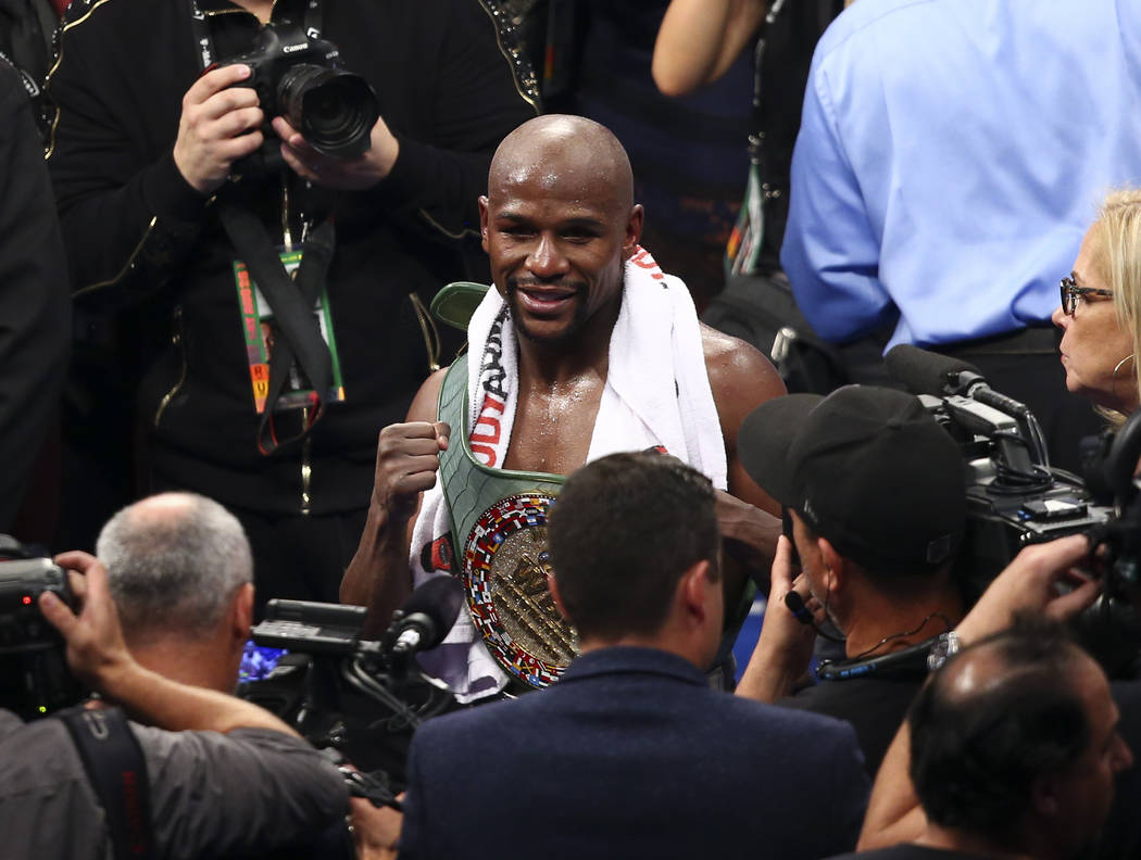 Floyd Mayweather Jr. after defeating Conor McGregor in their super welterweight fight at T-Mobile Arena, Saturday, Aug. 26, 2017, in Las Vegas. Mayweather won via 10th round technical knockout. Ch ...