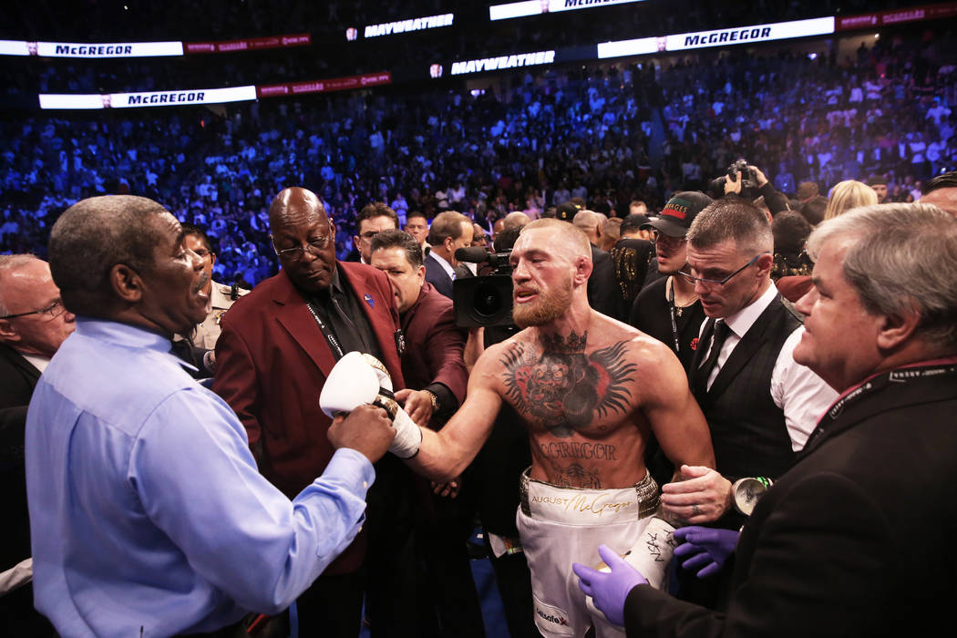 Conor McGregor, right, shakes referee Robert Byrd's hand after his TKO loss to Floyd Mayweather on Saturday, Aug 26, 2017, at T-Mobile Arena, in Las Vegas. Benjamin Hager Las Vegas Review-Journal ...