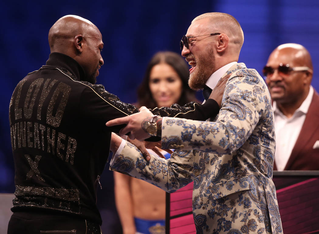 Floyd Mayweather, left, and Conor McGregor joke around at the post fight press conference on Saturday, Aug 26, 2017, at T-Mobile Arena, in Las Vegas. Benjamin Hager Las Vegas Review-Journal @benja ...