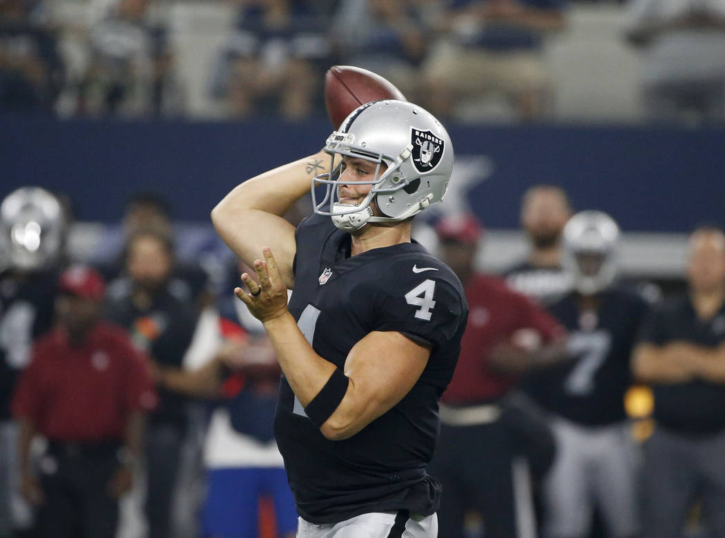 Oakland Raiders quarterback Derek Carr (4) throws a pass in the first half of a preseason NFL football game against the Dallas Cowboys on Saturday, Aug. 26, 2017, in Arlington, Texas. (AP Photo/Ro ...