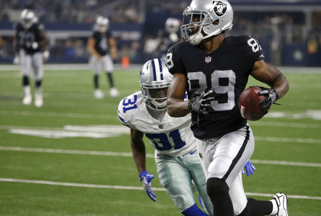 Oakland Raiders wide receiver Amari Cooper (89) sprints to the end zone for a touchdown after catching a pass as Dallas Cowboys safety Byron Jones (31) gives chase in the first half of a preseason ...