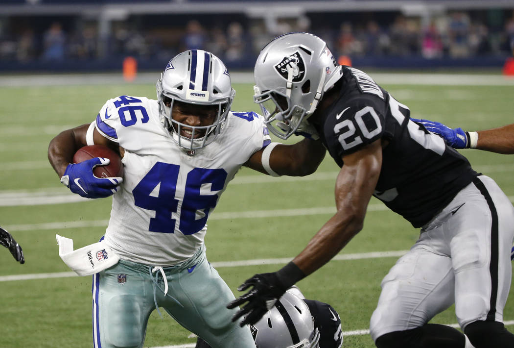 Dallas Cowboys' Alfred Morris (46) is tackled after a run by Oakland Raiders safety Obi Melifonwu (20) in the second half of a preseason NFL football game, Saturday, Aug. 26, 2017, in Arlington, T ...