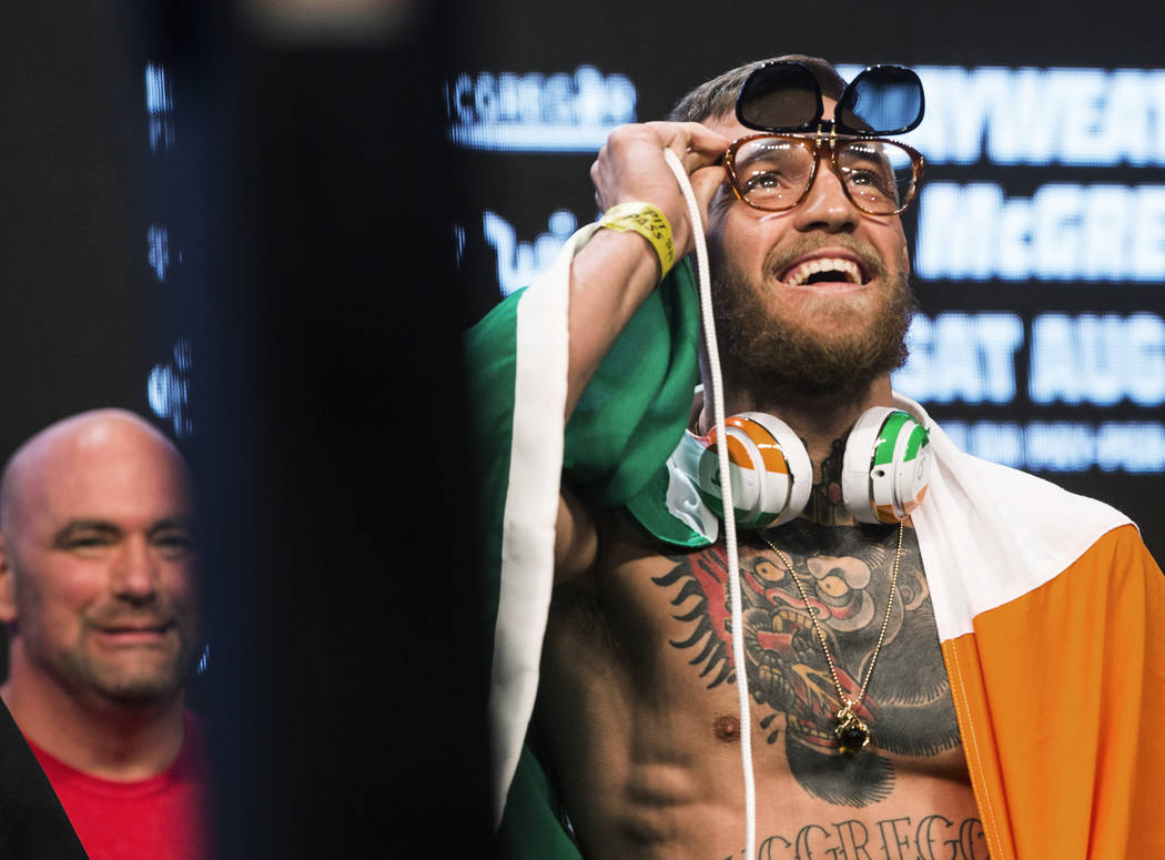 Conor McGregor, right, looks into the crowd during weigh-ins on Friday, Aug 25, 2017, at T-Mobile Arena, in Las Vegas. Benjamin Hager Las Vegas Review-Journal @benjaminhphoto