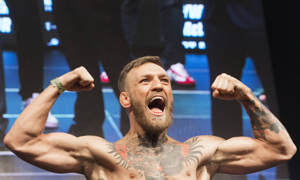 Conor McGregor pumps up the crowd as he steps on the scale during weigh-ins on Friday, Aug 25, 2017, at T-Mobile Arena, in Las Vegas. Benjamin Hager Las Vegas Review-Journal @benjaminhphoto
