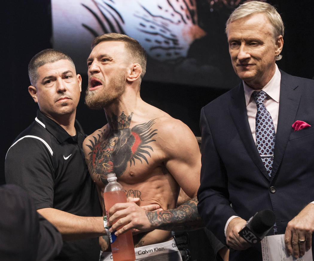 Conor McGregor, middle, screams at Floyd Mayweather Jr. during weigh-ins on Friday, Aug 25, 2017, at T-Mobile Arena, in Las Vegas. Benjamin Hager Las Vegas Review-Journal @benjaminhphoto