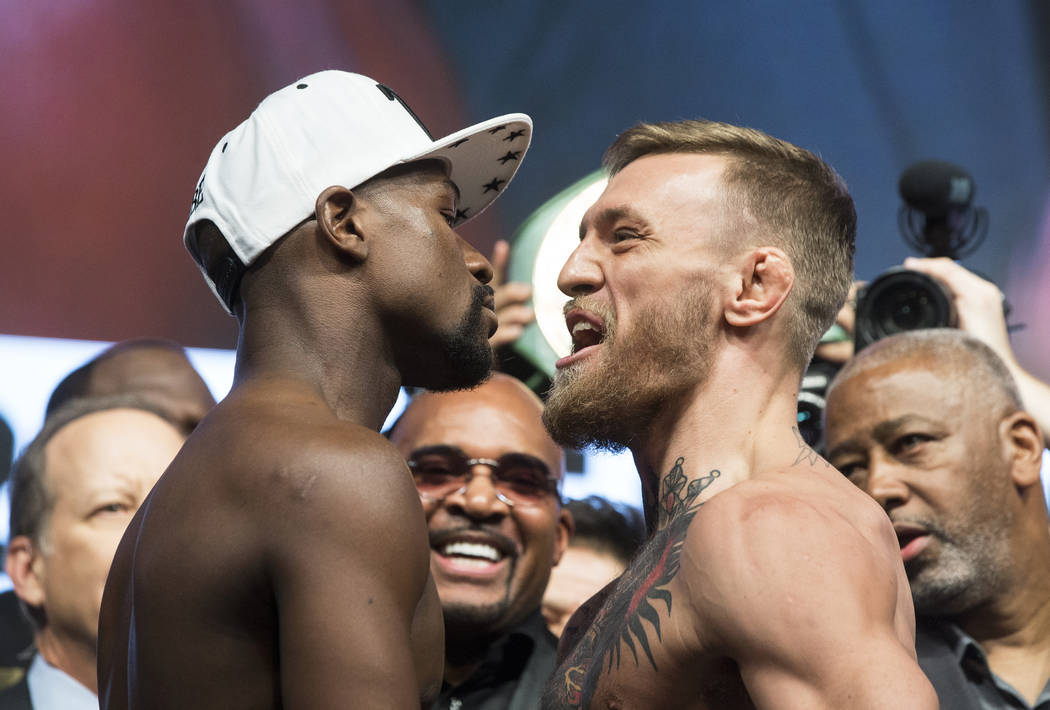 Conor McGregor, right, screams at Floyd Mayweather Jr. during weigh-ins on Friday, Aug 25, 2017, at T-Mobile Arena, in Las Vegas. Benjamin Hager Las Vegas Review-Journal @benjaminhphoto