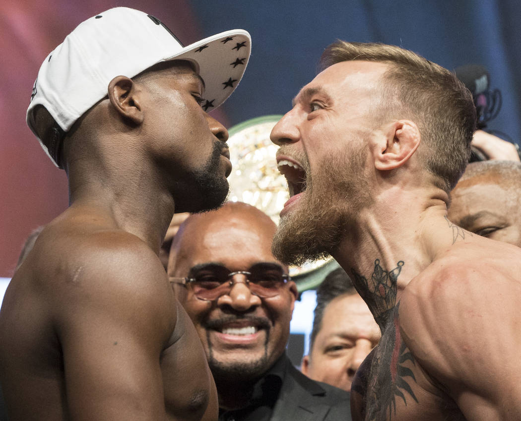 Conor McGregor, right, screams at Floyd Mayweather Jr. during weigh-ins on Friday, Aug 25, 2017, at T-Mobile Arena, in Las Vegas. Benjamin Hager Las Vegas Review-Journal @benjaminhphoto