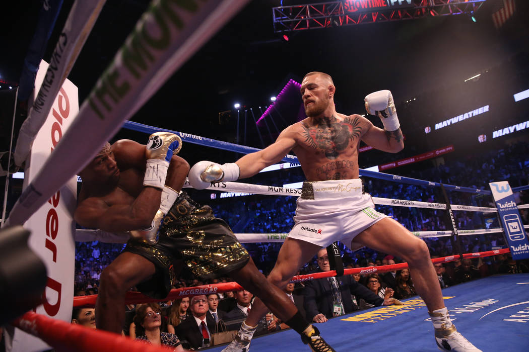 August 26, 2017 - Las Vegas, NEVADA, USA - Floyd Mayweather Jr., (Black and  Gold shorts), fights Conor McGregor (White Shorts)in a super welterweight  boxing match Saturday, Aug. 26, 2017, in Las