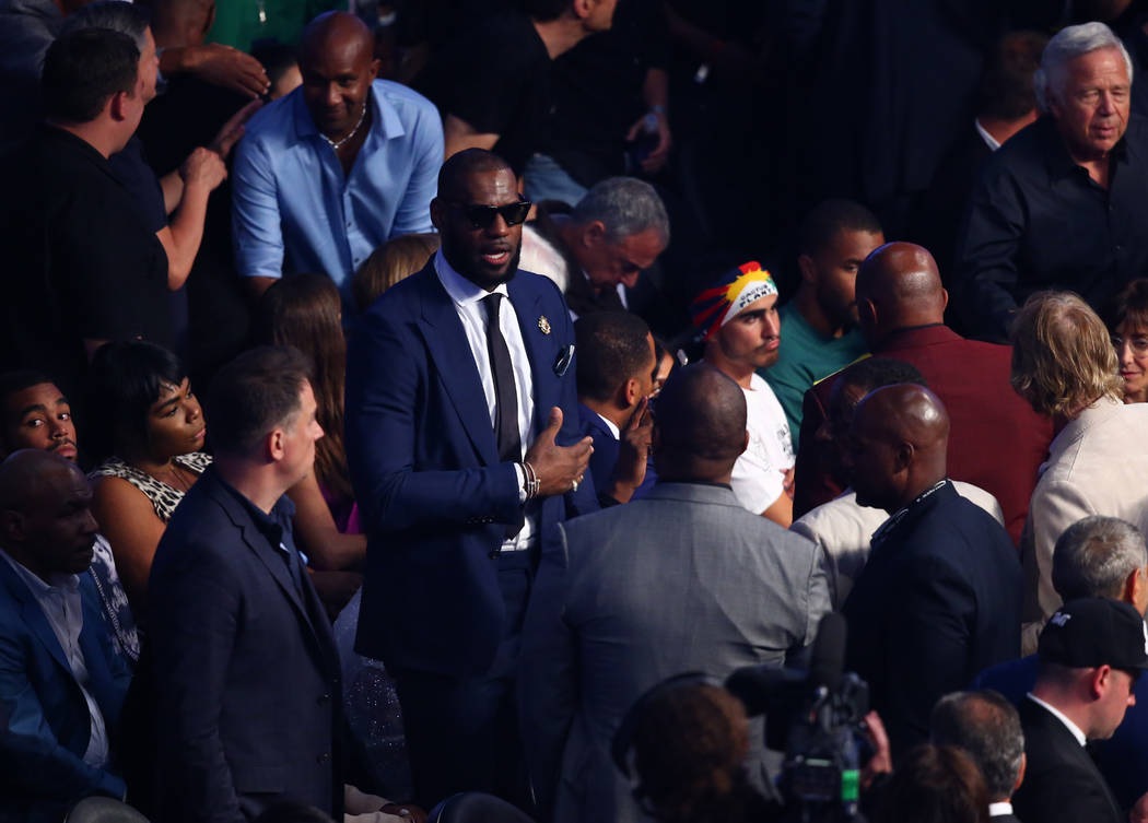 Lebron James takes his seat before the Floyd Mayweather Jr. and Conor McGregor fight at T-Mobile Arena, Saturday, Aug. 26, 2017, in Las Vegas. Chase Stevens Las Vegas Review-Journal