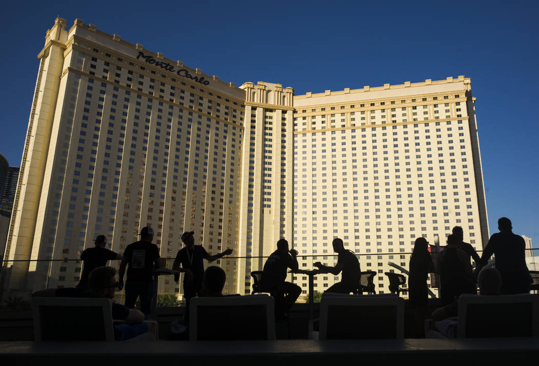 Fans relax by an outdoor patio before Floyd Mayweather Jr. takes on Conor McGregor at T-Mobile Arena, Saturday, Aug. 26, 2017, in Las Vegas. Chase Stevens Las Vegas Review-Journal
