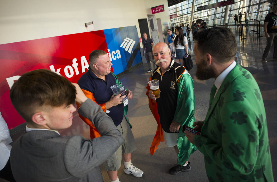 Conor McGregor fans, from left, Everett Johnston Jr., Ruby Freeman, Paul Tauber and Everett Johnson talk the famed UFC fighter takes on Floyd Mayweather Jr. at T-Mobile Arena, Saturday, Aug. 26, 2 ...