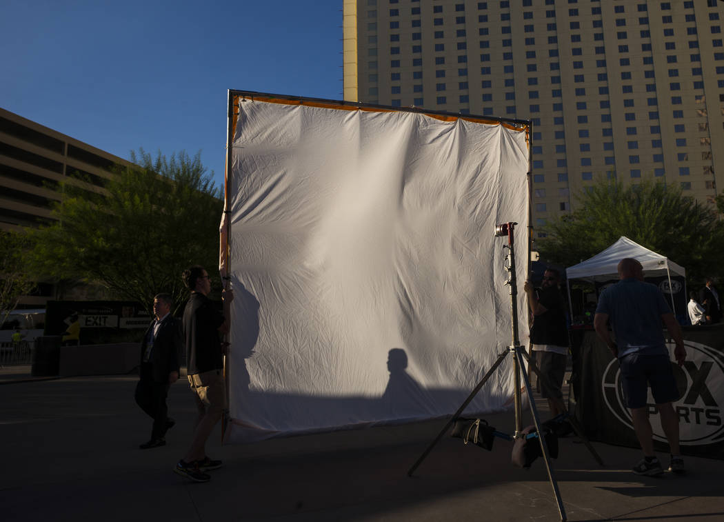 A production crew moves a screen before Floyd Mayweather Jr. takes on Conor McGregor at T-Mobile Arena, Saturday, Aug. 26, 2017, in Las Vegas. Chase Stevens Las Vegas Review-Journal