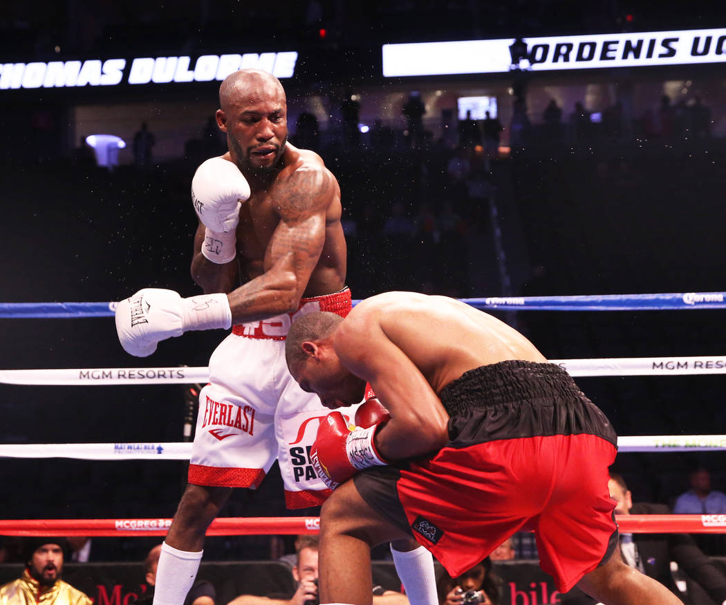 Yordenis Ugas, left, lands a punch against Thomas Dulorme in the 9th round on Saturday, Aug 26, 2017, at T-Mobile Arena, in Las Vegas. Benjamin Hager Las Vegas Review-Journal @benjaminhphoto