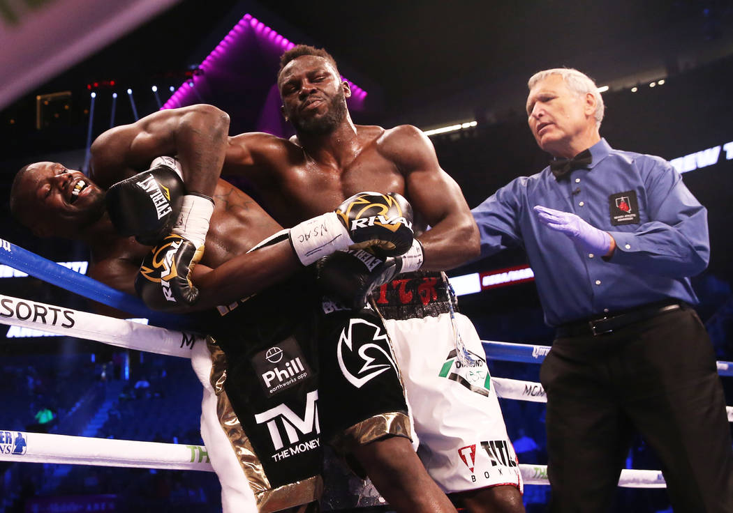 Steve Cunningham, right, gets tied up with Andrew Tabiti in the 8th round on Saturday, Aug 26, 2017, at T-Mobile Arena, in Las Vegas. Benjamin Hager Las Vegas Review-Journal @benjaminhphoto