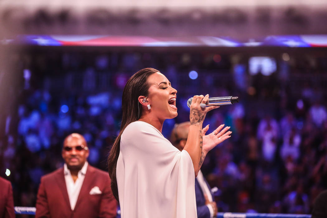 Demi Lovato singing the national anthem before Floyd Mayweather Jr. takes on Conor McGregor at T-Mobile Arena, Saturday, Aug. 26, 2017, in Las Vegas. Benjamin Hager Las Vegas Review-Journal