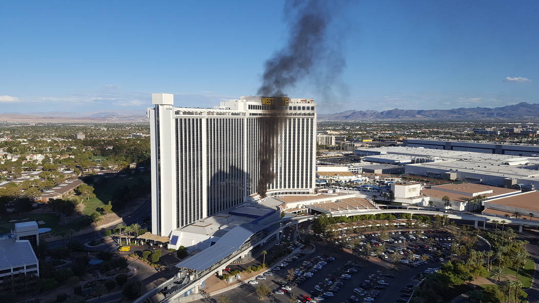 A fire burns outside a third-floor balcony at the Westgate at 3000 Paradise Road in Las Vegas on Saturday Aug. 26, 2017. James Fuhrman