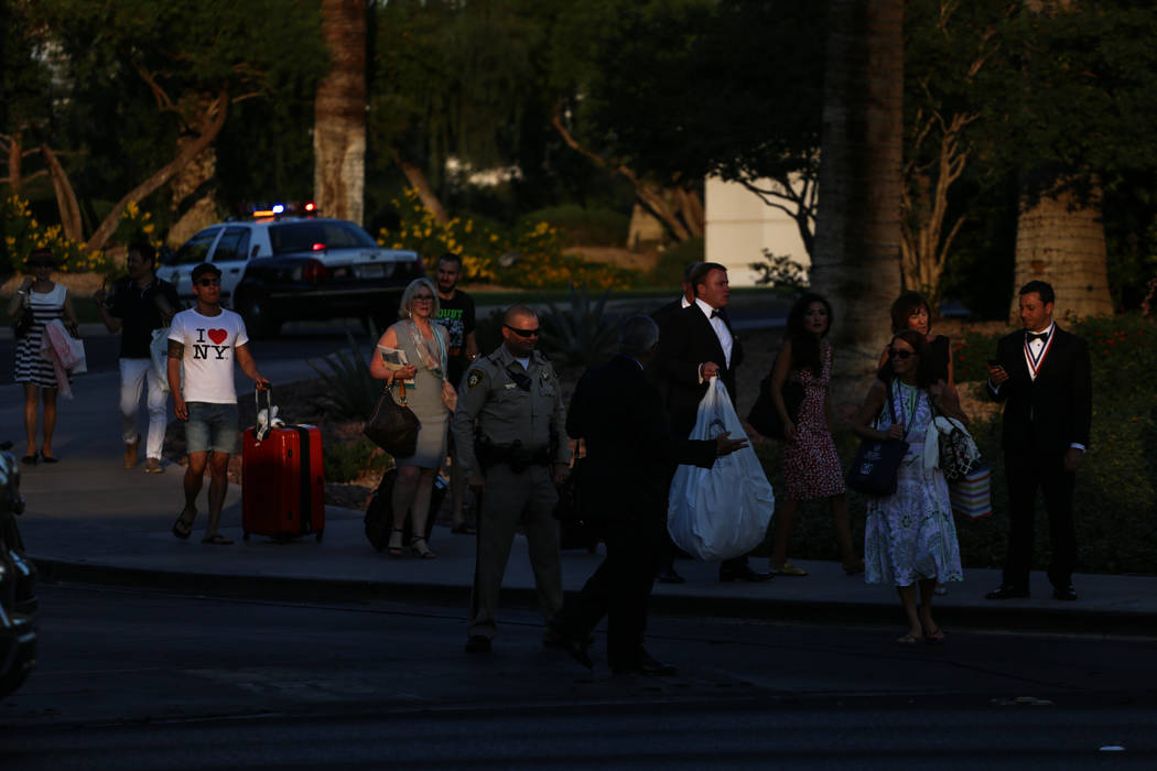 Hotel guests walk outside of the Westgate after a balcony fire broke out in Las Vegas on Aug. 26, 2017. Joel Angel Juarez Las Vegas Review-Journal @jajuarezphoto